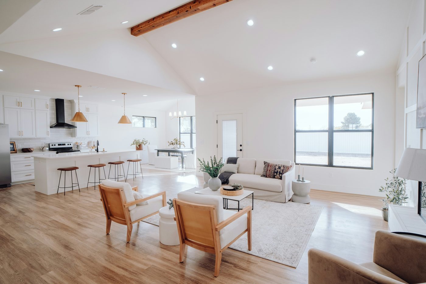 Bright, spotlessly clean open-plan living room and kitchen